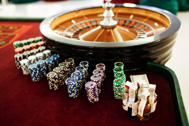 Colorful casino chips on roulette table